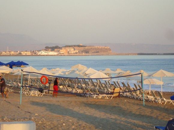 The beach in the morning in Rethymno. In the background is the great Fortezza.