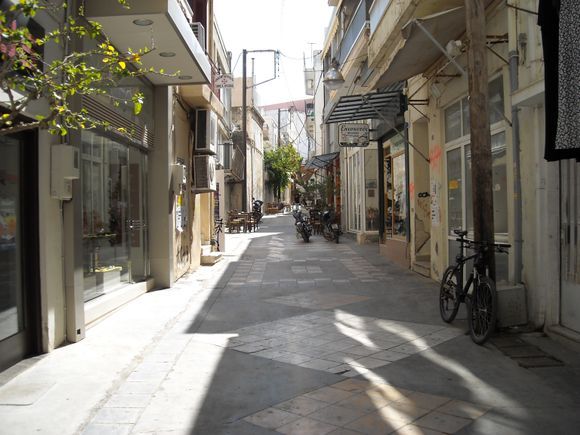 Typical side street in the city of Heraklion... tavernas and scooters