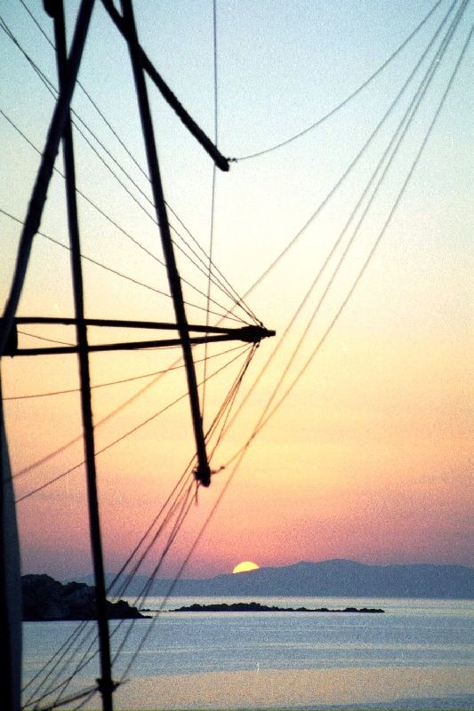 Mykonos sunset behind the windmills.