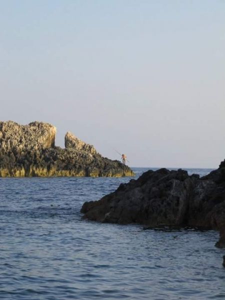 Lonley fisherman in Limnionas