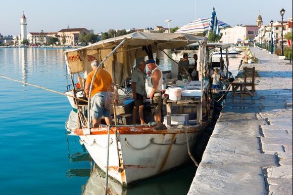 Early morning in Zante: Fishermen selling their catch directly from the boat