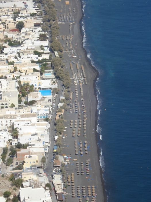 The view of Kamari\'s black sand beach from ancient Thira.