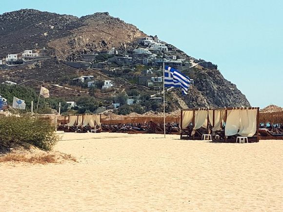 Mykonos august 2017, Elia is the longest sandy beach of Mykonos, fully organized, offering a wide choice of taverns and bars as well as water sports facilities such as water-skiing, parasailing and windsurfing.