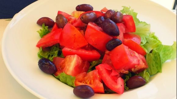 Corfu island, tomato salad in Xenia restaurant situated in Paleokastritsa beach