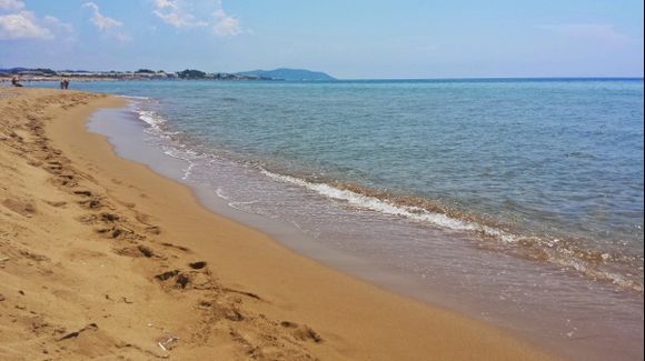 Corfu island, Issos is a beautiful beach located 35 km southern of Corfu. The endless seashore with the unique sand dunes and the crystalline waters offers an ideal destination for families. The rich flora divides the shore from the most important wetland of Corfu, the Korission Lake. In the right side of the beeach is possible to stay nude.