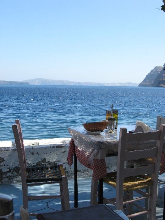 Santorini, a view from a restaurant by the arbour of Thirasia island