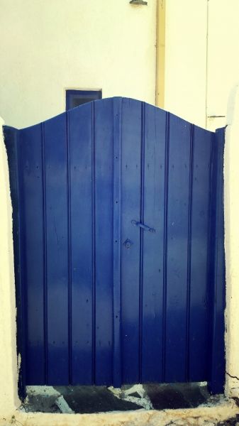 Leros island, the blue door of a windmill in Panteli.