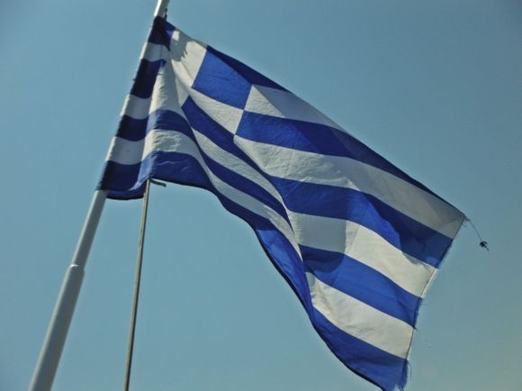 Kalymnos island, the greek flag in the Pothia