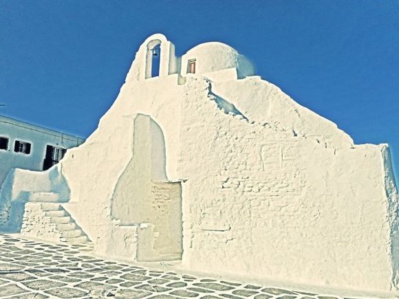 Mykonos august 2017, The lovely church of Panagia (Virgin Mary) Paraportiani is among the most photographed churches not only in Mykonos, but in the whole world. It is located at the entrance of Kastro neighbourhood, right by the sea. Its name (Paraportiani) actually means standing next to the entrance door, meaning that the church was next to the Castle door.