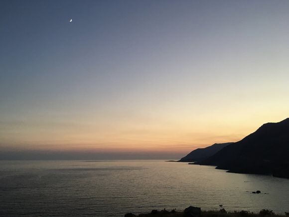 Sunset with crescent moon, south Crete near Sfakia