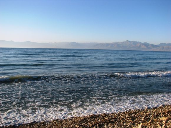 Greek beach, Albanian mountains.