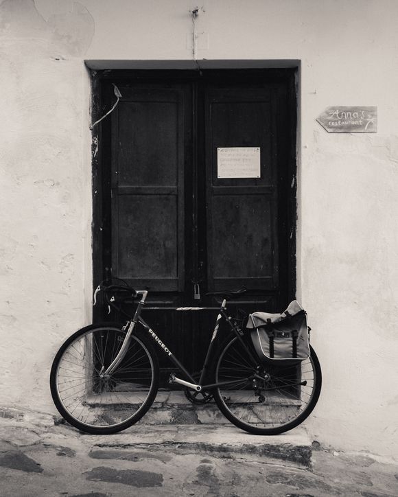 A bicycle outside a house.