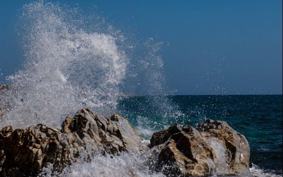 Waves hits the rock\'s Agios Isidoros Beach.