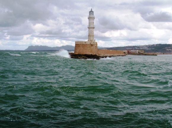 Crete. The Venetian lighthouse at the entrance to the old port at Chania.