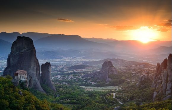 Sunset at Meteora. In the left is the holy Monastery of Rousanou.