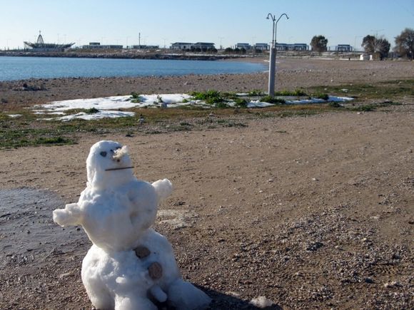 Snowman on the beach. Glyfada