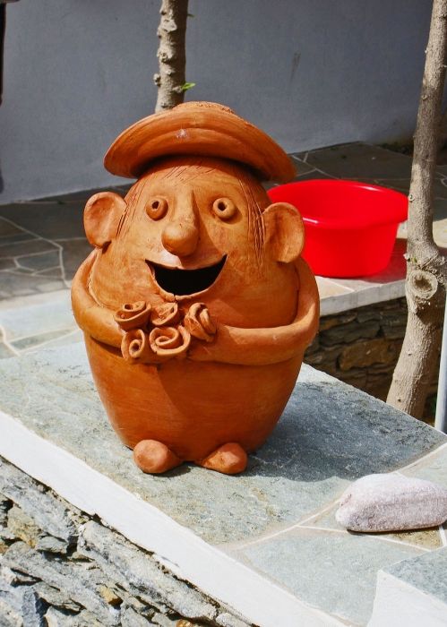 One of the many village potters displayed this whimsical figure outside his pottery shop to draw customers in Platys Gialos on Sifnos island