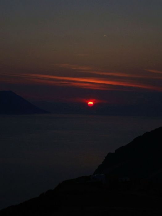 Our 3 week island trip ended on Milos.  The last night we ate in Plaka, then walked to a church above the bay to see our last sunset. We saw the sun drop as the dark grew,down to the last ember
