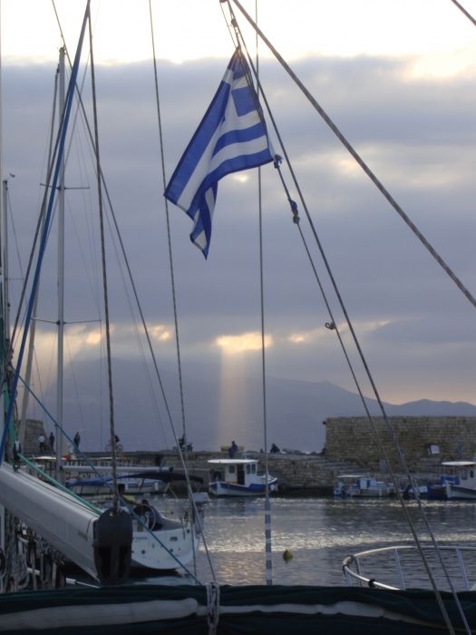 Our first day in Heraklion we took a stroll at the harbor.  A storm was rolling down from the mountains and a sudden sunbeam popped out through the clouds providing a neat background for the forests o