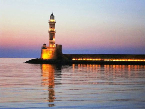 The old fort Venetian Lighthouse takes on a stunning image at dusk.