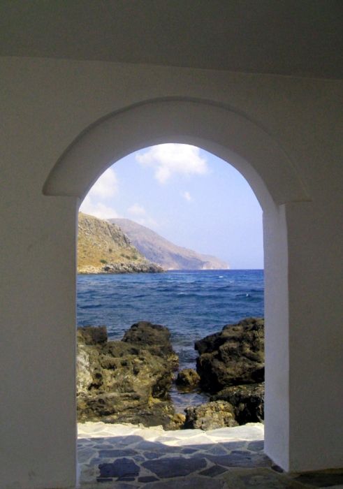 I captured this shot at a small church in Georgiopolis resort. Its located at the end of a long walkway, surrounded by the sea. 
This is the view I saw when I looked through one of the open archways of this pretty church.
Lens - 6mm
Apeture - F8
Shutter Speed - 1/400
ISO - 200