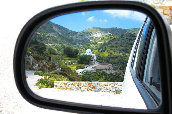 View of Apiranthos in Car mirror reflection