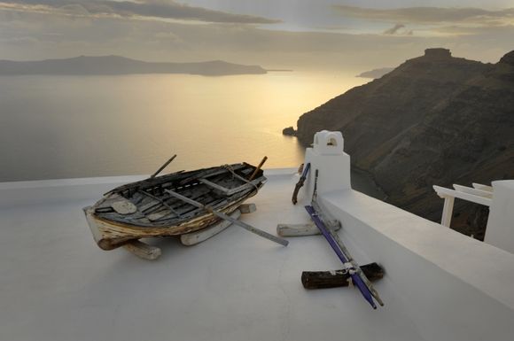 Boat on roof of a hotel in Firastefani Santorini