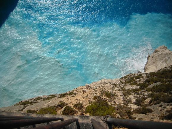 Navagio,Zakynthos.
Hard to understand this color.why it\'s so milky and whitish?? yeah it was quite windy and wavy, white sand moves around in the water?perhaps.