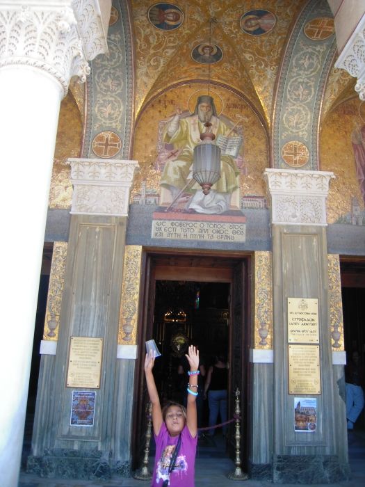 Agia Dionysios, Zakynthos. Gypsy girl intends to be in the photo.