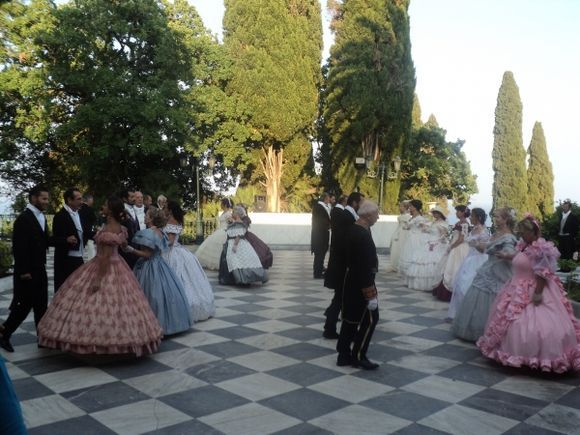 Performing at the yard of Achilleion- We would frequently see this dance group performing in many spots of Corfu, like at the Old Fortress and Liston