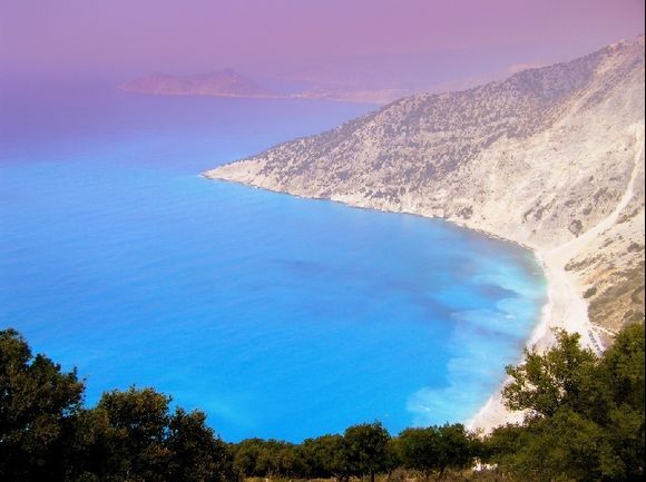 Myrtos beach on a strange day full of forest fires smoke clouds and that beautiful Ionian turquoise color