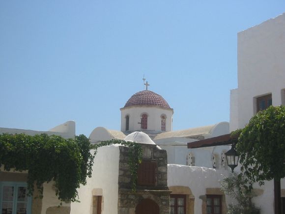 Another church rises above the houses in Chora