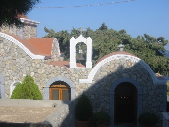 Agios Savvas monastery; the candles inside and the view outside the church