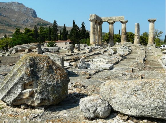 The temple of Apollo in Ancient Corinth and it\'s many scattered pieces.