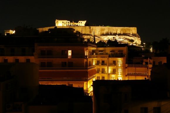 The Acropolis by night, looking down over the Athens skyline.