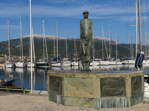 Statue of Nikos Kavvadias (Sami Port). The Greek poet Nikos Kavvadias traveled the world as a sailor and wrote about the adventures of life at sea.